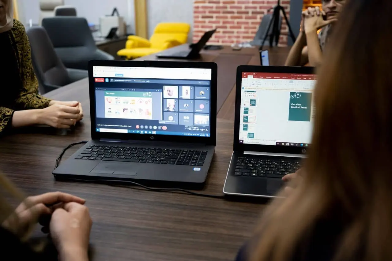Team meeting around a computer